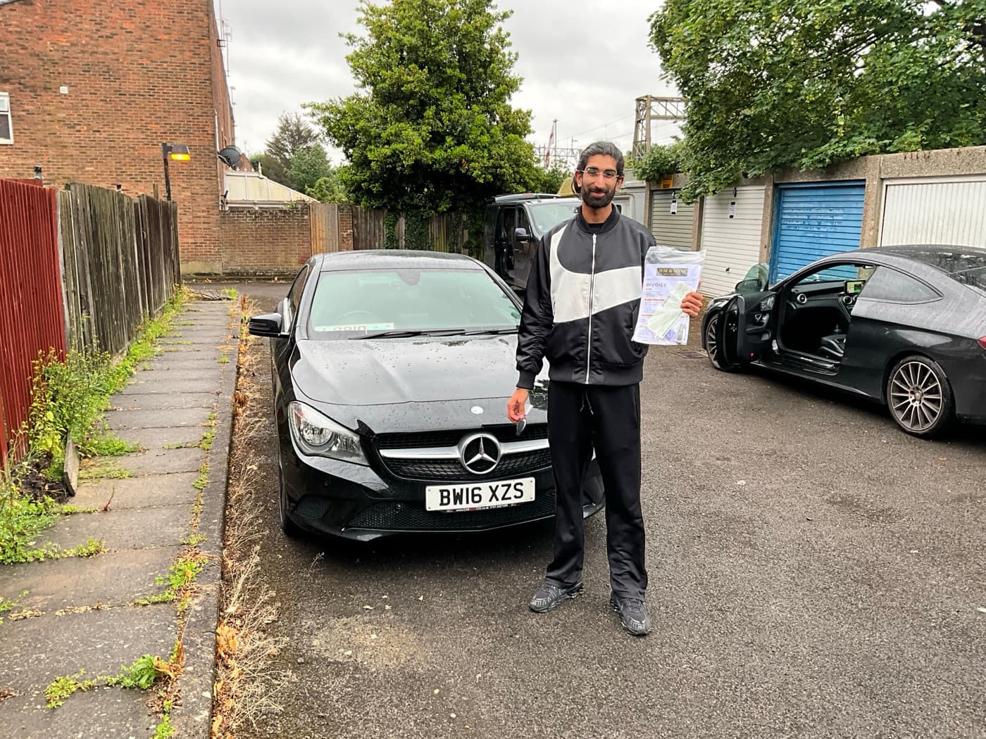 A happy customer collecting their car
